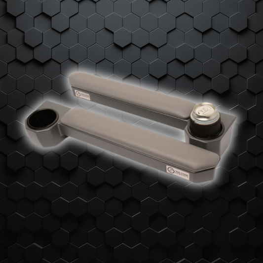 Cushioned grey one stone armrest for 70 series Landcruiser, displayed against a textured black background.