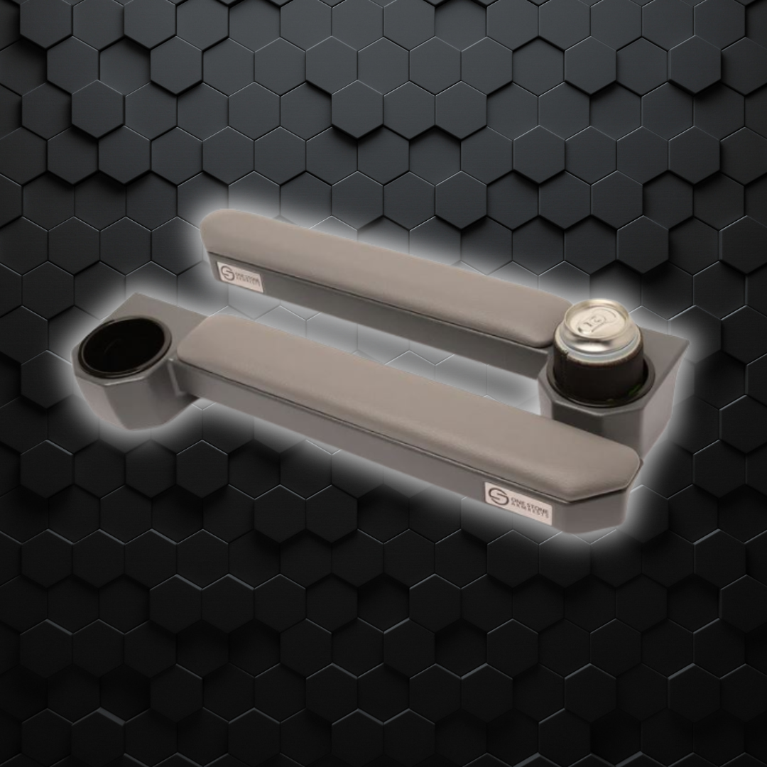 Cushioned grey one stone armrest for 70 series Landcruiser, displayed against a textured black background.